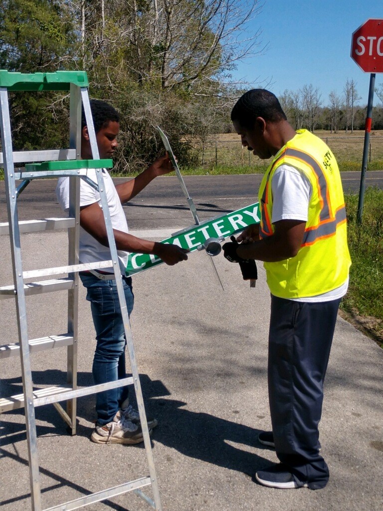 mayor putting up signs
